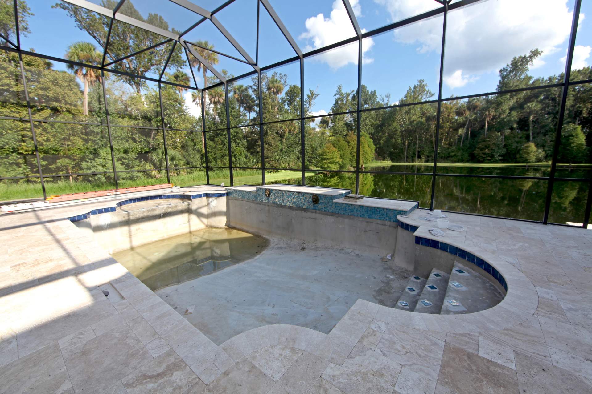 Empty pool with new marble deck